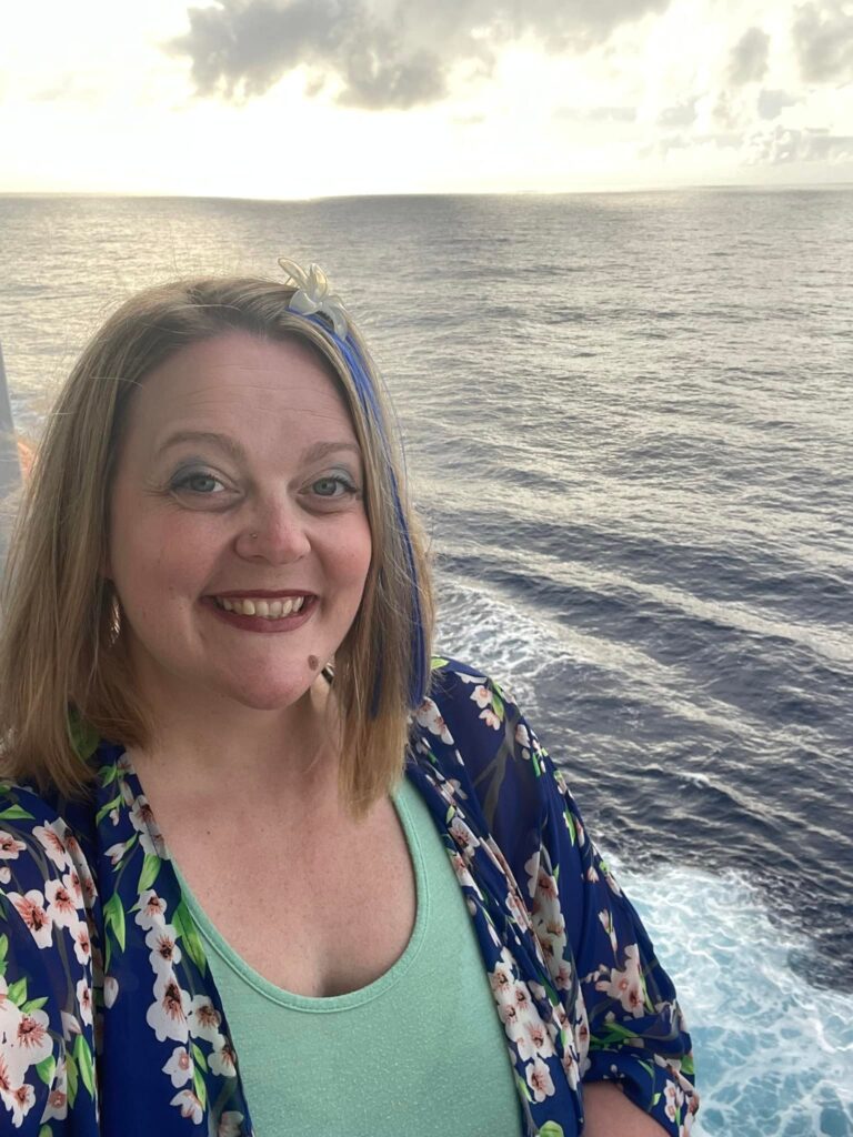 Photo of Jamie Chambers on the balcony of a Hawaiian Cruise